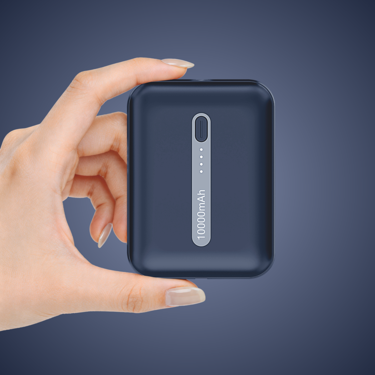 Muvtech Zip 10 10,000mAh power bank in Navy Blue, held between two fingers