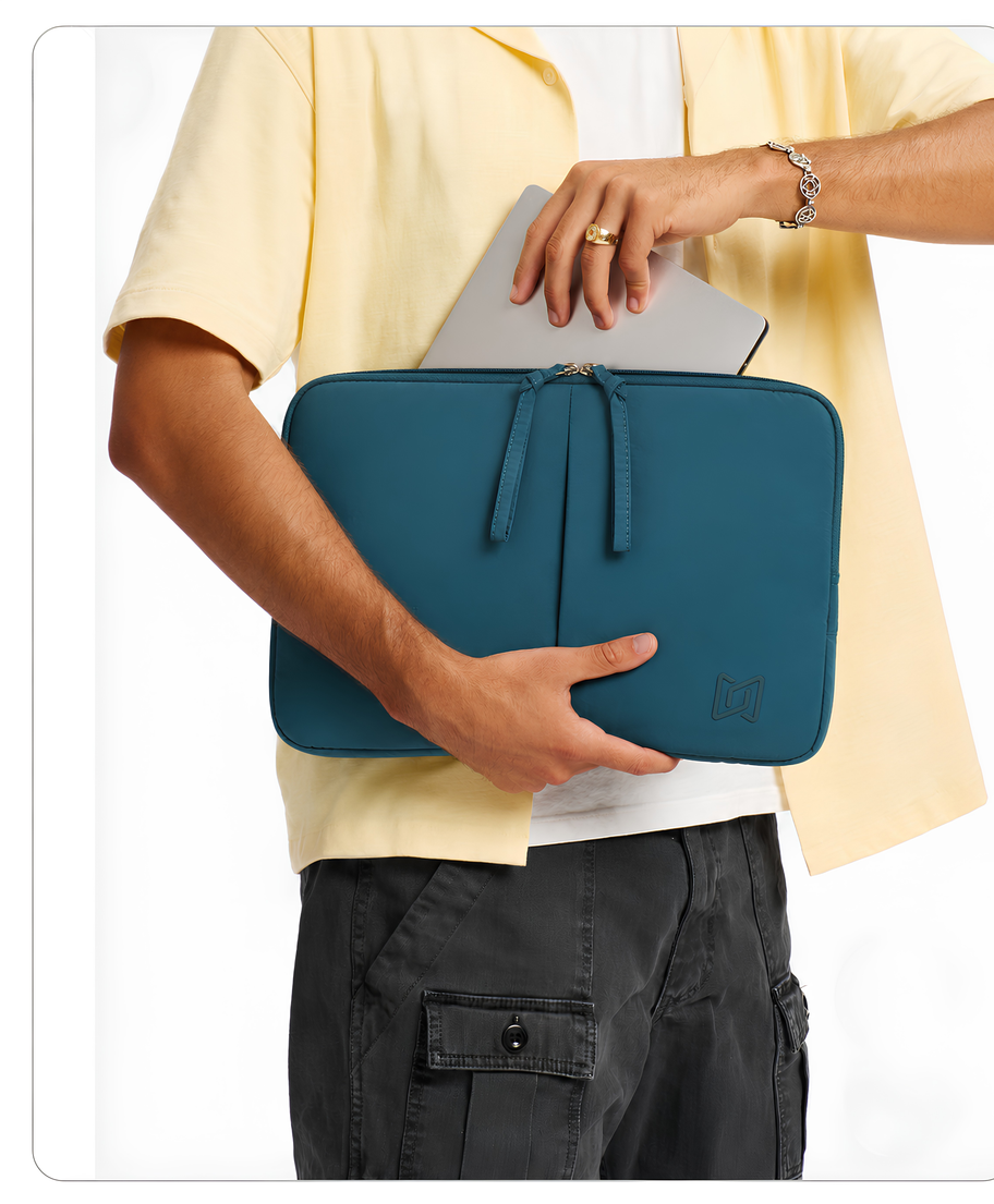 The Port Laptop Sleeve in Teal Blue carried in hand #Color_Teal Blue