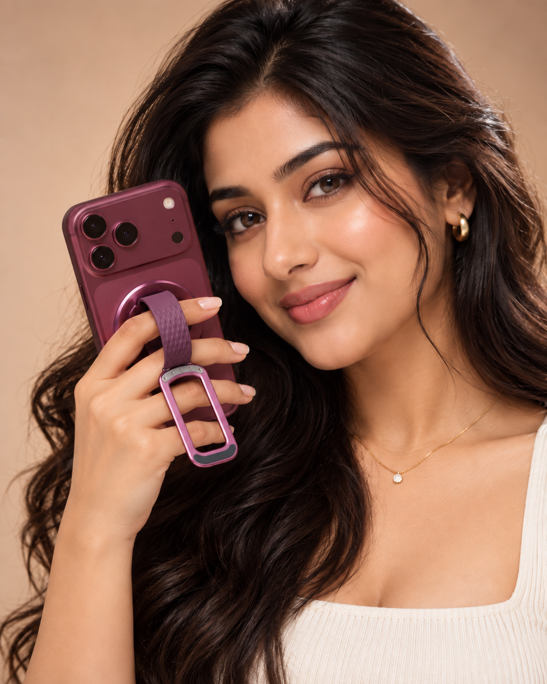 Woman holding an iPhone by the Burgundy Loop grip