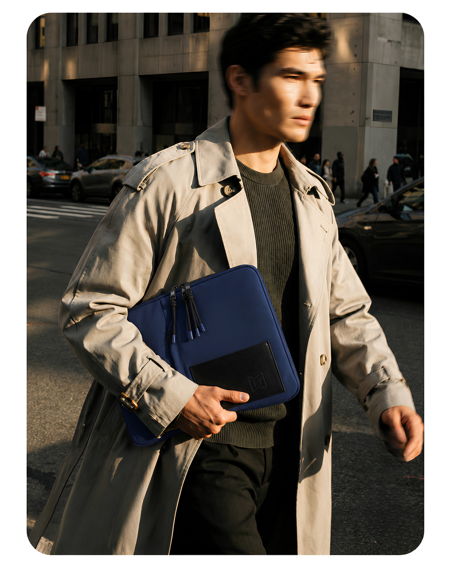 The Loft Laptop Sleeve in Blue carried in hand #Color_Blue