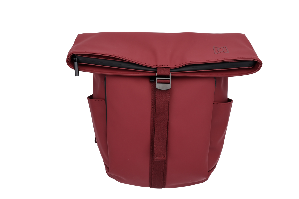 The Outpost Roll-Top Backpack in Burgundy, front view with retention strap #Color_Burgundy