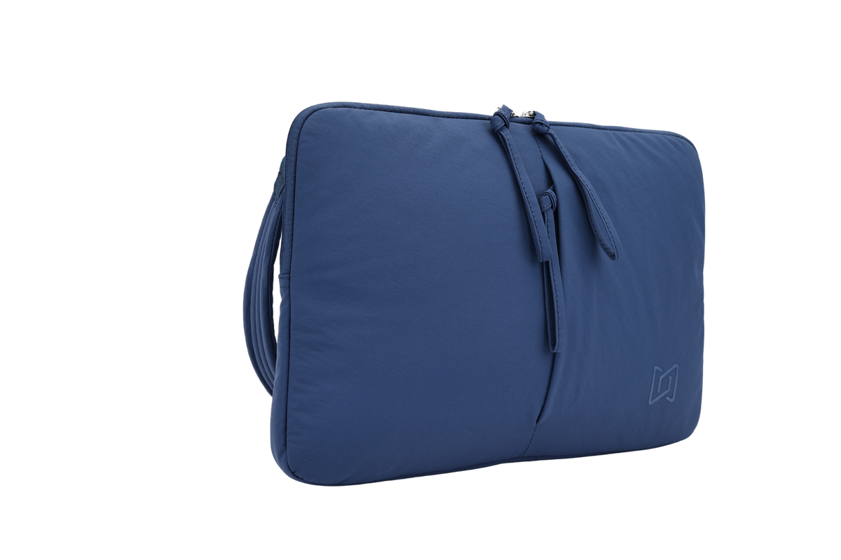 The Port Laptop Sleeve in Blue, angled view #Color_Blue