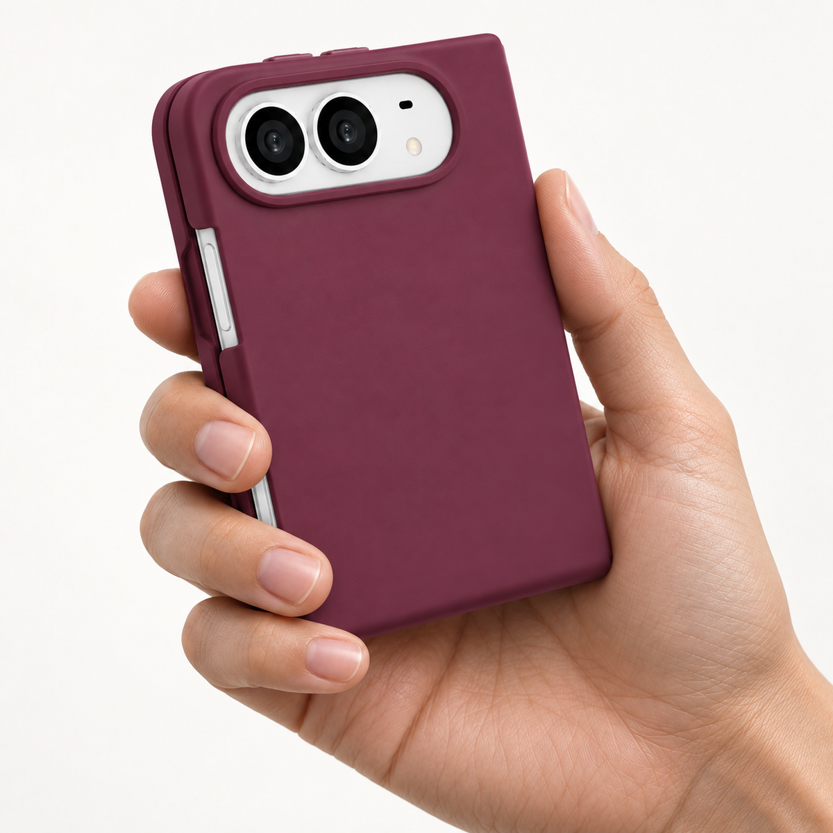 Muvtech Sera Case for iPhone Duo in Burgundy, silicone finish held in one hand #Color_Burgundy